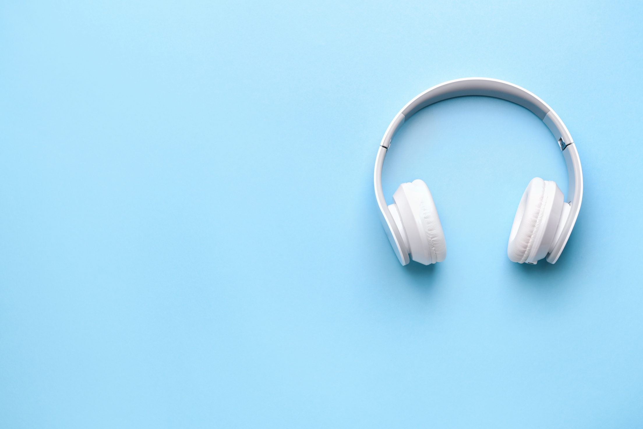 Modern Headphones on Color Background